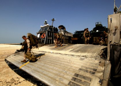 US Navy 081018-N-4236E-389 Marines from the 26th Marine Expeditionary Unit (26th MEU) depart a landing craft air cushion assigned to Assault Craft Unit (ACU) 4 from the multi-purpose amphibious assault ship USS Iwo Jima (LHD 7)