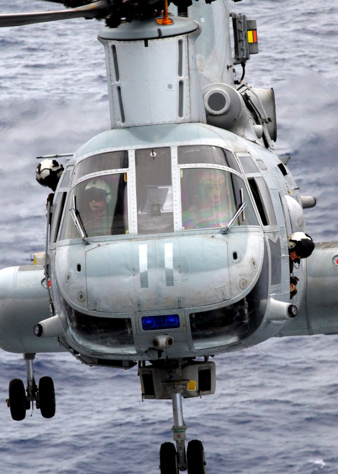 US Navy 081017-N-2183K-052 A CH-46E Sea Knight helicopter approaches the flight deck of the amphibious assault ship USS Peleliu (LHA 5)