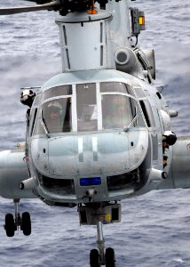US Navy 081017-N-2183K-052 A CH-46E Sea Knight helicopter approaches the flight deck of the amphibious assault ship USS Peleliu (LHA 5)