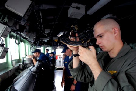 US Navy 081020-N-1635S-001 Lt. Case Garrison reads the measurements on a statometer to measuring the range from the Ticonderoga-class guided-missile cruiser USS Chancellorsville (CG 62) to the Military Sealift Command fast comb