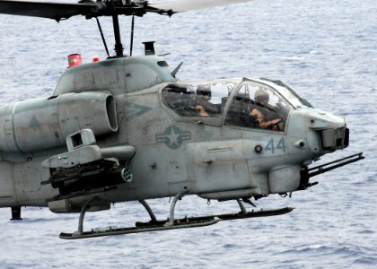 US Navy 081017-N-2183K-062 An AH-1W Super Cobra helicopter gunship descends over the flight deck of the amphibious assault ship USS Peleliu (LHA 5)