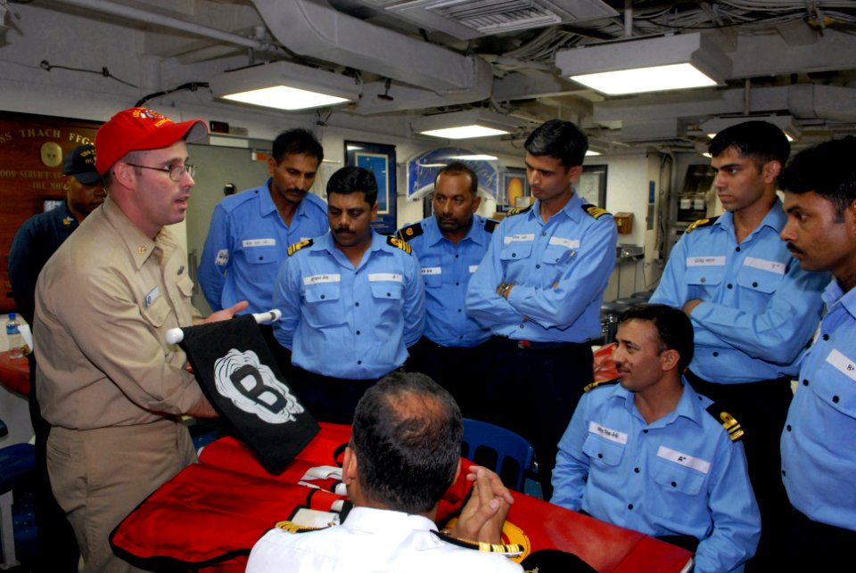 US Navy 081018-N-1635S-010 Chief Damage Controlman Tom Kennedy demonstrates U.S. damage control techniques to sailors of the Indian Navy aboard the guided-frigate USS Thach (FFG 43)