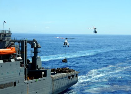 US Navy 081019-N-0120A-149 Two EH-96 Puma helicopters from the Military Sealift Command dry cargo ship USNS Richard E. Byrd (T-AKE-4) take turns delivering supplies