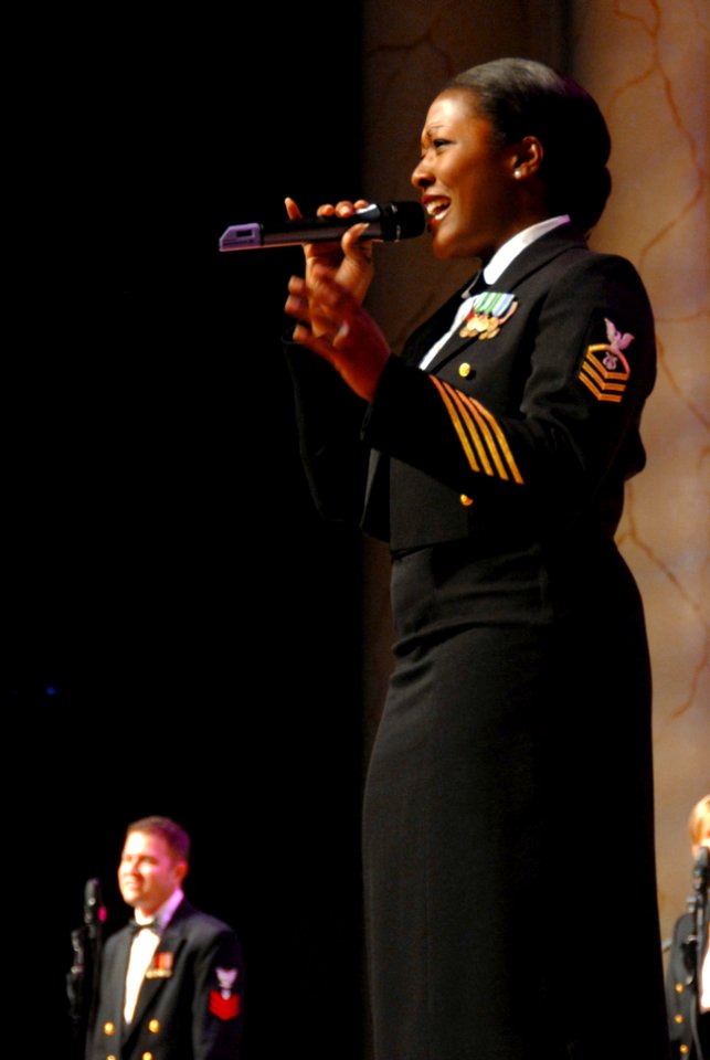 US Navy 081018-N-0773H-077 Chief Musician Yolanda C. Pelzer sings during the Navy Band's performance of the 233rd Navy Birthday Concert