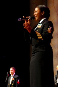 US Navy 081018-N-0773H-077 Chief Musician Yolanda C. Pelzer sings during the Navy Band's performance of the 233rd Navy Birthday Concert