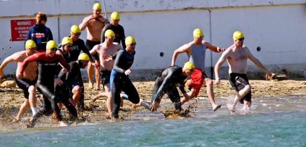 US Navy 090212-N-9689V-003 Participants race into the water at Smugglers Cove, Naval Base Point Loma kicking off the base's 15th annual photo