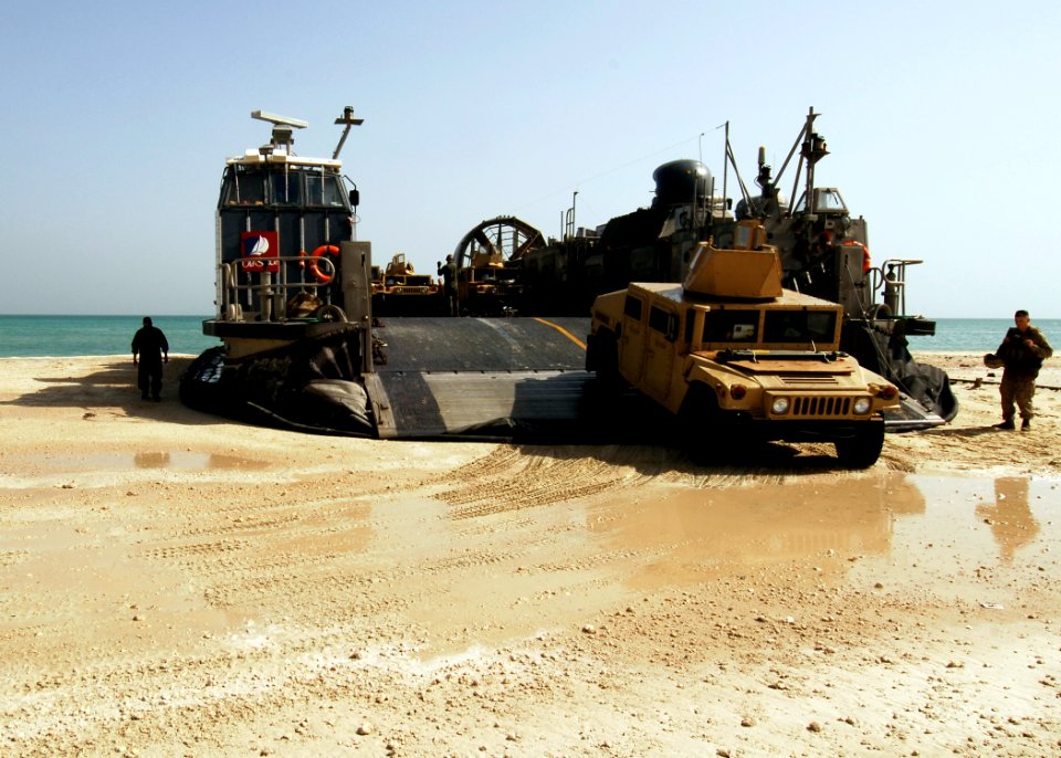 US Navy 081018-N-4236E-250 Vehicles from the 26th Marine Expeditionary Unit (26th MEU) depart a landing craft air cushion assigned to Assault Craft Unit (ACU) 4 from the multi-purpose amphibious assault ship USS Iwo Jima (LHD 7