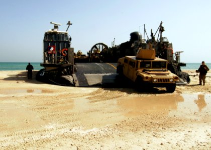 US Navy 081018-N-4236E-250 Vehicles from the 26th Marine Expeditionary Unit (26th MEU) depart a landing craft air cushion assigned to Assault Craft Unit (ACU) 4 from the multi-purpose amphibious assault ship USS Iwo Jima (LHD 7