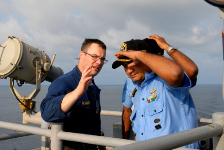 US Navy 081020-N-1635S-014 Lt. Cmdr. Douglas Meagher, acting executive officer of the Ticonderoga-class guided-missile cruiser USS Chancellorsville (CG 62), speaks with Indian Navy sailors outside the ship's pilot house