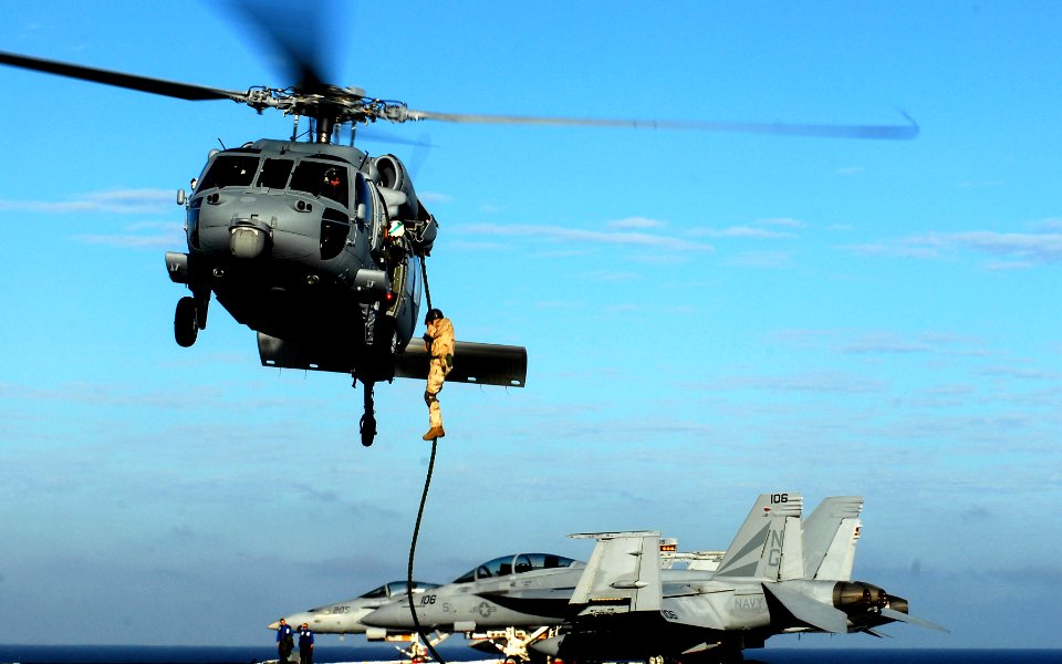 US Navy 081018-N-9928E-152 Senior Chief Explosive Ordnance Disposal Jon Culver fast ropes from an MH-60S Sea Hawk