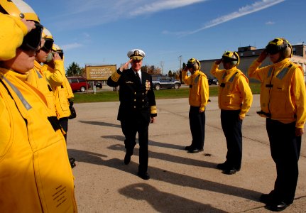 US Navy 081018-N-8273J-249 Chief of Naval Operations (CNO) Adm. Gary Roughead salutes side boys after participating in the christening ceremony for the Arleigh Burke-class guided-missile destroyer USS Wayne E. Meyer
