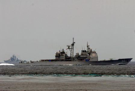 US Navy 081022-N-7730P-037 The Ticonderoga-class guided missile cruiser USS Chancellorsville (CG 62) parallels the wake of the Nimitz-class aircraft carrier USS Ronald Reagan (CVN 76)