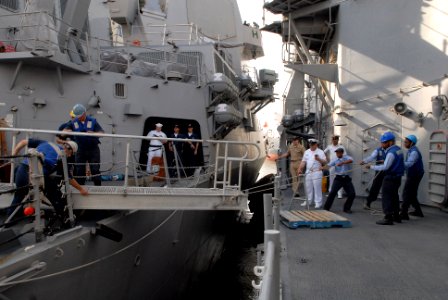 US Navy 081018-N-1635S-006 Sailors connect the brow between the Ticonderoga-class guided-missile cruiser USS Chancellorsville (CG 62) and the Arleigh Burke-class guided-missile destroyer USS Gridley (DDG 101) while making a sch