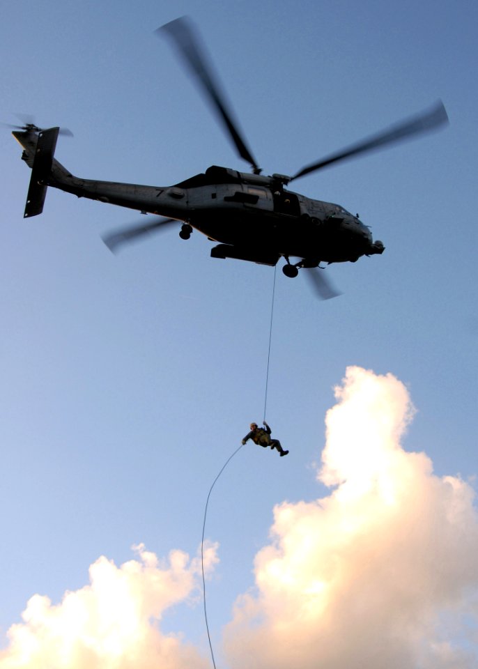 US Navy 081023-N-1038M-046 A Sailor fast ropes from an HH-60H Sea Hawk
