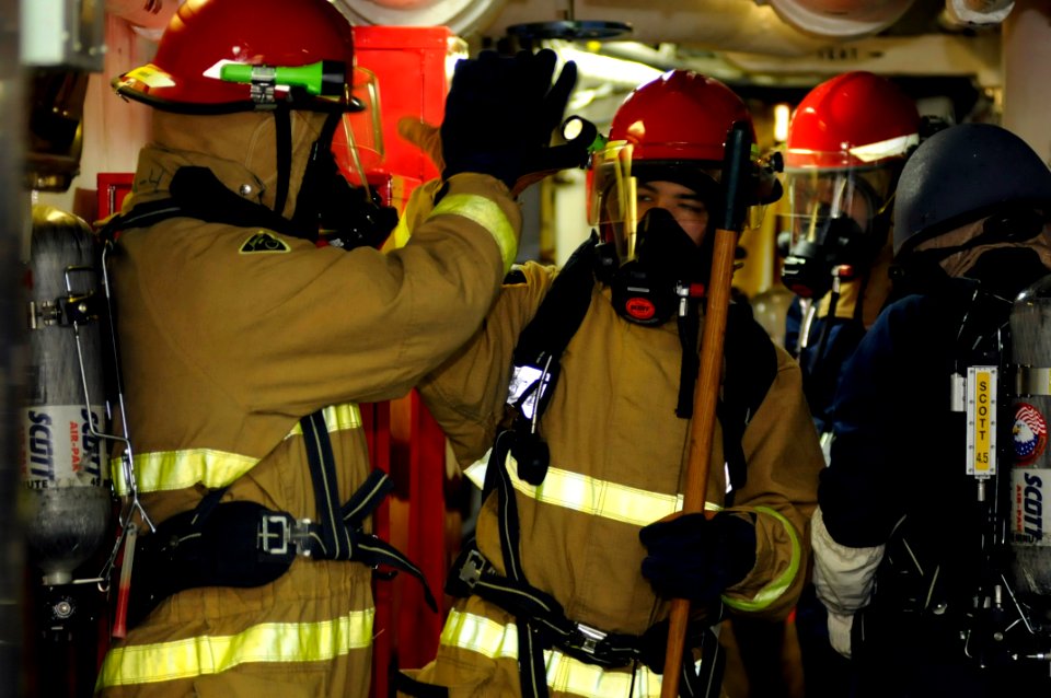 US Navy 081029-N-8546L-118 Sailors ) celebrate after successfully combating a simulated main space fire