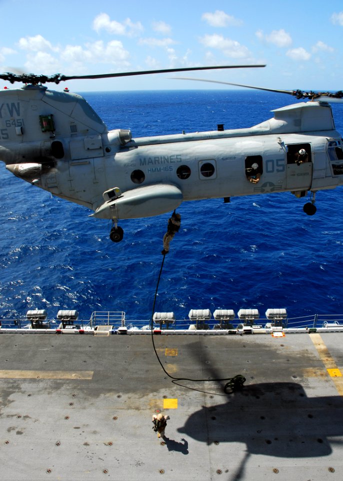 US Navy 081021-N-2183K-010 Marines perform fast-rope training exercises from a CH-46E Sea Knight helicopter onto the flight deck of the amphibious assault ship USS Peleliu (LHA 5)