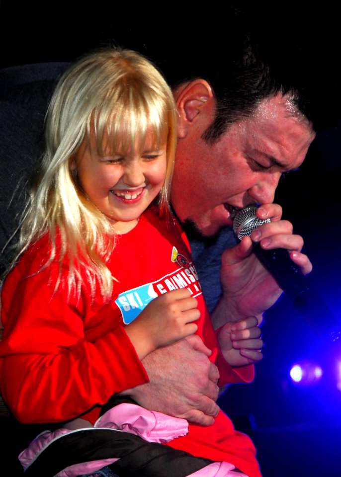 US Navy 081030-N-0483B-001 Steve Harwell sings to a child from the audience during a concert at Fleet Activities Yokosuka