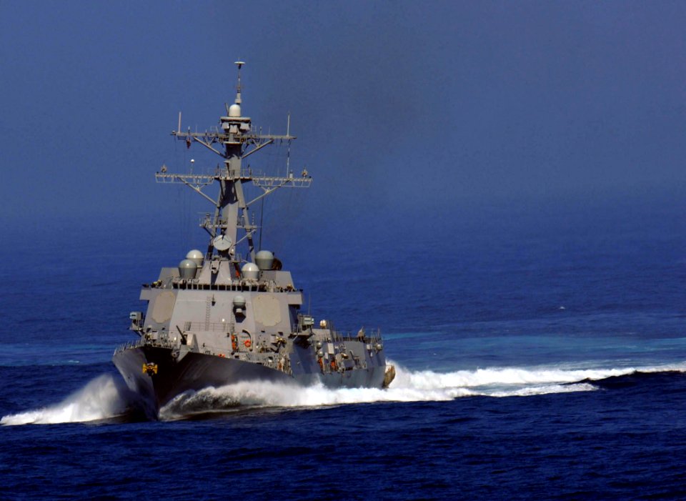 US Navy 081021-N-9928E-057 The Arleigh Burk-class guided-missile destroyer USS Kidd (DDG 100) steams behind the Nimitz-class aircraft carrier USS John C. Stennis (CVN 74)