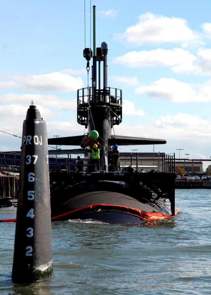 US Navy 081022-N-7668G-022 The weapons loading team of the Los Angeles-class attack submarine USS Newport News (SSN 750) guides a Tomahawk missile onto the ship