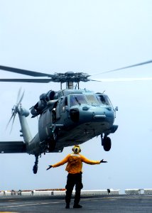 US Navy 081021-N-5148B-149 A Landing Signal Enlisted directs an MH-60S Sea Hawk helicopter