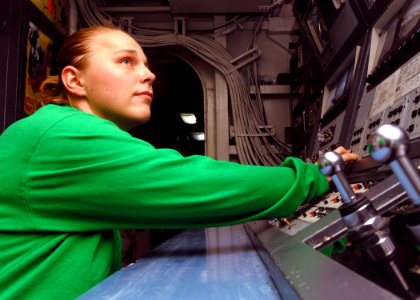 US Navy 081026-N-2456S-040 Electrician's Mate Fireman Apprentice Caren Lorenzen stands watch in the integrated launch and recovery television surveillance control room