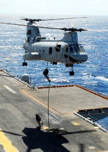 US Navy 081021-N-2183K-029 Marines perform fast-rope training exercises from a CH-46E Sea Knight helicopter onto the flight deck of the amphibious assault ship USS Peleliu (LHA 5) photo