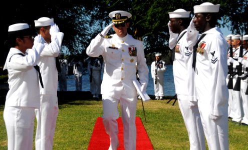 US Navy 081023-N-9758L-015 Capt. David Adler salutes as he is piped through sideboys