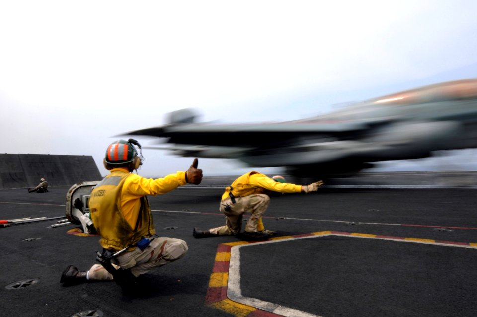 US Navy 081021-N-3659B-206 Lt. Cmdr. Charles Prim gives the thumbs up sign as Lt. Douglas Steil launches an EA-6B Prowler