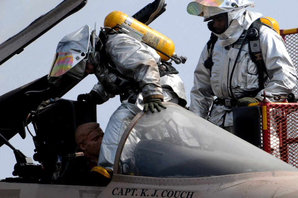 US Navy 081022-N-3659B-006 Sailors assigned to the crash and salvage team practice removing an injured aviator