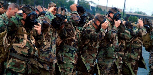 US Navy 081024-N-7367K-001 Seabees assigned to Naval Mobile Construction Battalion (NMCB) 1 don their MCU-2P gas masks during a chemical, biological and radiological (CBR) warfare drill at Naval Construction Battalion Center, G