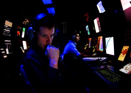 US Navy 081024-N-6538W-011 Operations Specialist Seaman Damian Bailey, from Crockett, Texas, stands radar watch in the Combat Direction Center aboard the Nimitz-class aircraft carrier USS John C. Stennis (CVN 74)