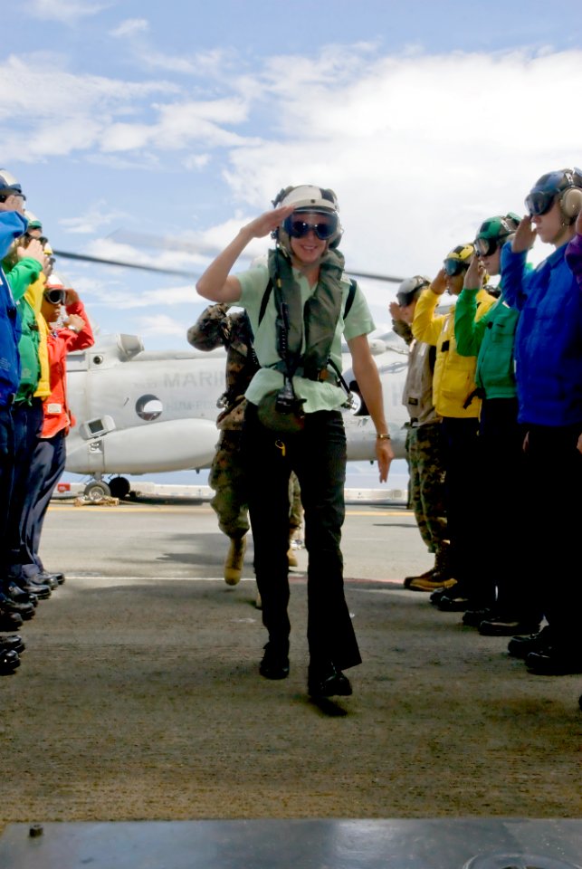US Navy 081026-N-5253W-009 U.S. Ambassador to the Philippines Kristie Kenney passes through sideboys as she arrives aboard the forward-deployed amphibious assault ship USS Essex (LHD 2)
