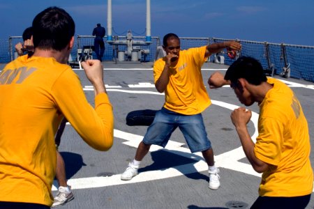 US Navy 081022-N-9123L-003 Gunner's Mate 1st Class Jorge Valerio leads Sailors in ship's reactionary force-basic training