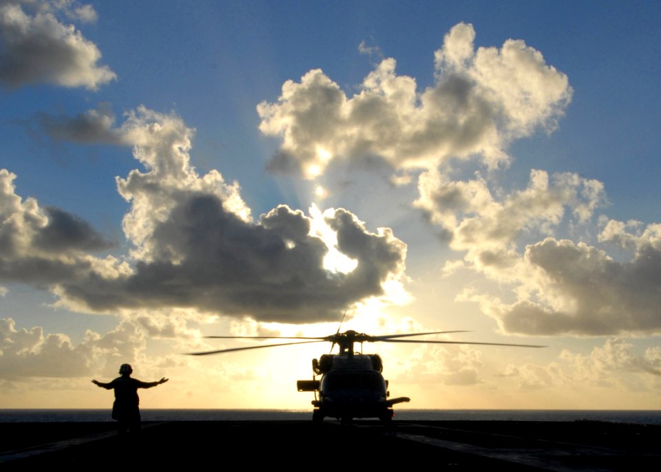 US Navy 081023-N-1038M-004 An aircraft director signals to an HH-60H Sea Hawk