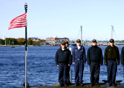 US Navy 081023-N-2966A-005 Submariners assigned to the Virginia-class attack submarine Pre-commissioning Unit New Hampshire (SSN 778) practice manning their ship during rehearsals for the boat's commissioning ceremony at Portsmouth photo