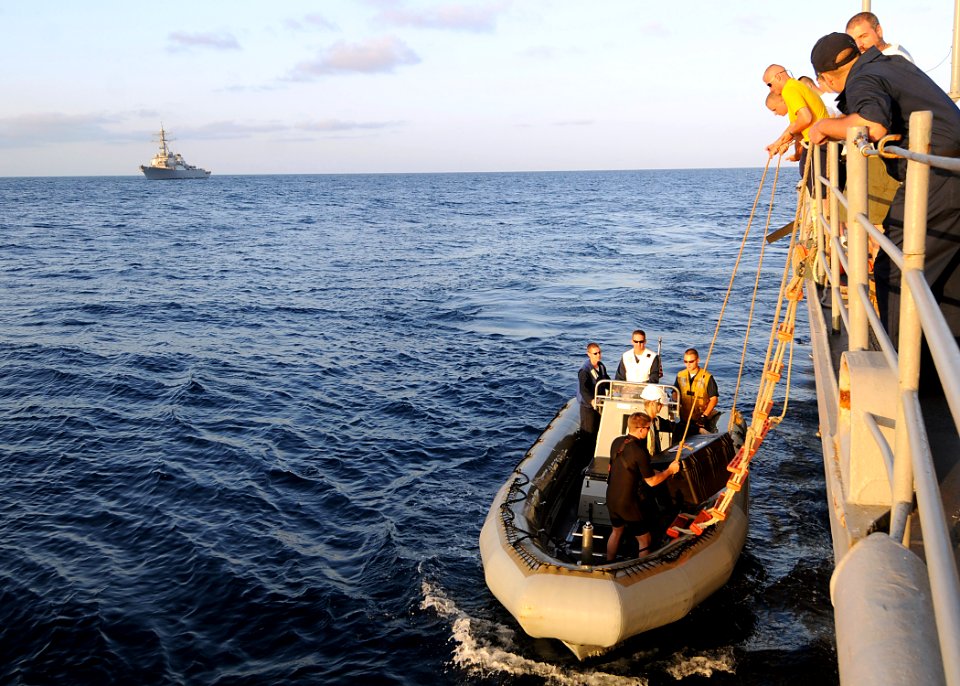 US Navy 081026-N-1082Z-110 Sailors conduct a personnel transfer via rigid hull inflatable boat with the guided-missile destroyer USS Mahan (DDG 72)