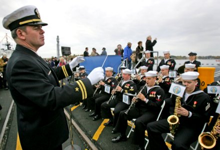 US Navy 081025-N-7441H-002 Lt. Carl Gerhard leads the Navy Band Northeast in a musical selection before the commissioning ceremony for the Virginia-class attack submarine USS New Hampshire (SSN 778) photo