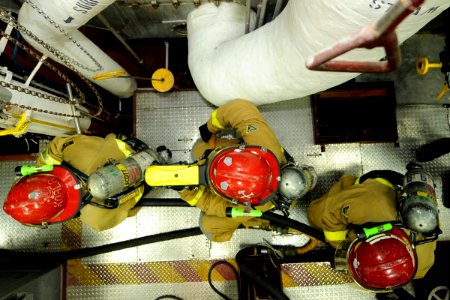 US Navy 081031-N-8546L-086 Sailors form a three-man attack team to combat a simulated fire