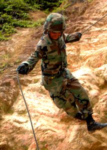 US Navy 081027-N-8816D-392 Equipment Operator 3rd Class Jose Alemanacevedo uses a 120 foot assault rope to repel down a 50 foot cliff