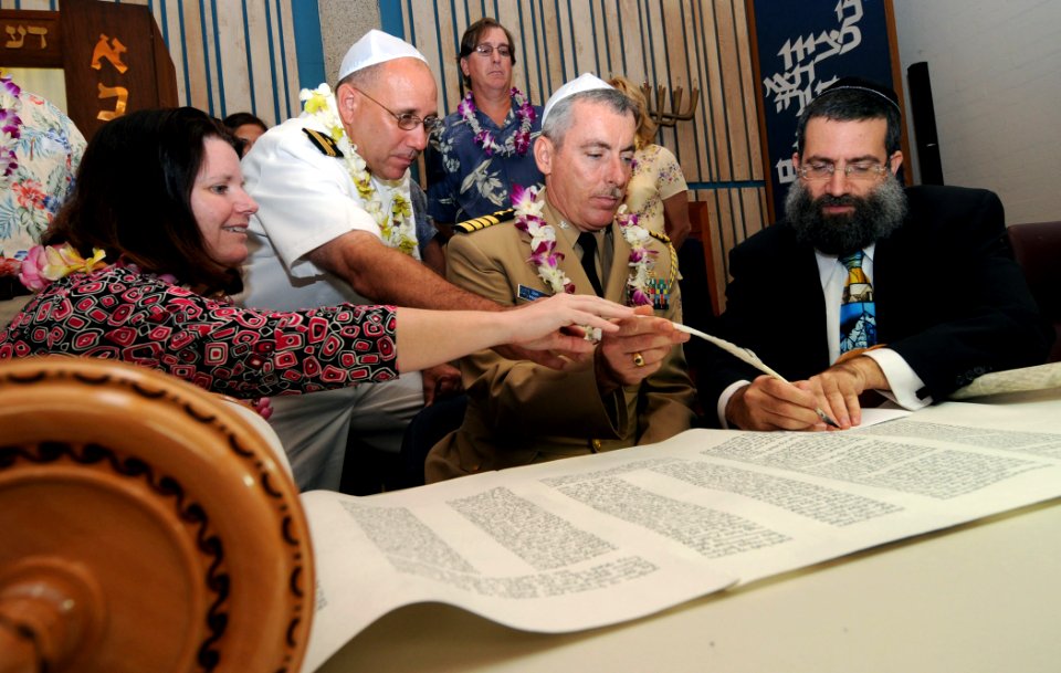 US Navy 081026-N-9758L-097 Torah dedication ceremony participants write one of the last letters in a new Sefer Torah at the Aloha Jewish Chapel at Naval Station Pearl Harbor