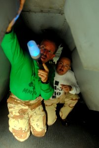 US Navy 081028-N-2456S-024 Lt. Cmdr. William Pratt, left, maintenance material control officer for the