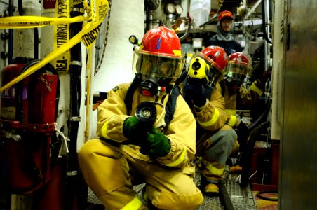 US Navy 081031-N-8546L-096 Sailors form a three man attack team to combat a simulated fire