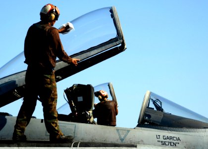 US Navy 081103-N-7571S-001 Plane captains wipe down the canopy windows of F-A-18 Hornets