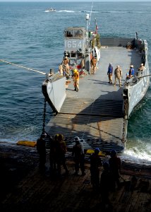 US Navy 081101-N-9134V-046 A landing craft utility from Assault Craft Unit (ACU) 2 embarks aboard the amphibious dock landing ship USS Carter Hall (LSD 50) photo