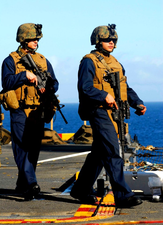 US Navy 081104-N-4774B-402 Aviation Ordnanceman 3rd Class Erik Brown and Aviation Ordnanceman 3rd Class Randy Flores participate in small arms live-fire training