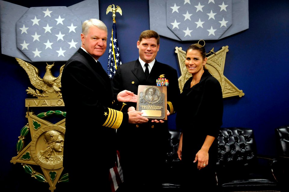 US Navy 081104-N-8273J-052 Chief of Naval Operations (CNO) Adm. Gary Roughead honors Cmdr. Robert E. Smith, along with wife, Cindy, with the Vice Adm. James B. Stockdale Leadership Award
