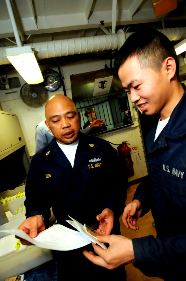 US Navy 081031-N-7280V-083 Machinist's Mate Fireman Zhicai Lu gets his new Navy Cash card