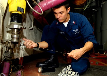 US Navy 081101-N-4954I-012 Aviation Boatswain's Mate (Fuel) 2nd Class Jeff Lockhart ses sounding tape to check JP-5 fuel levels