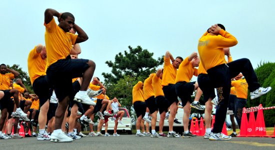 US Navy 081031-N-0807W-068 Sailors at Fleet Activities Sasebo stretch and warm-up before participating in three and five kilometer fun runs photo