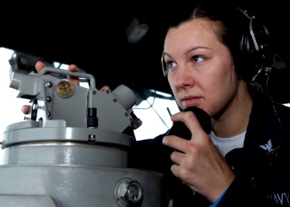 US Navy 081105-N-9520G-014 Operations Specialist 3rd Class Cindy R. Skinner, from Madison Heights, Mich., uses a telescopic alidade to make reports on surface contacts aboard the amphibious assault ship USS Essex (LHD 2)